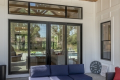 Covered Exterior Porch With Large Slider Door with Transom Window