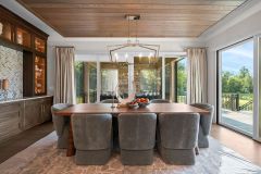 White oak ceiling treatment in dining area with access to covered porch