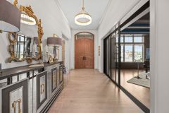 Mahogany front door with arched transom in foyer