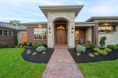 Stone arch covered front porch