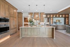 Large Island with Quartzite countertop, Light and Dark Stained Cabinetry