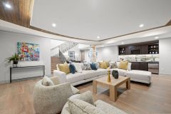 Media Room In Lower Level With Wood Accent Ceiling and Bar