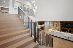 Open Staircase With Wood Accent Ceiling To Lower Level
