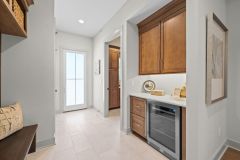 Mudroom with Bench and drop zone with beverage fridge