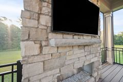 Stone Fireplace in Screened In Porch