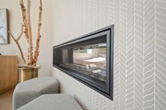 Primary Suite Two sided Fireplace Tile