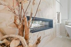 Primary Bathroom With 2 Sided Fireplace