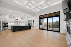 Great-Room-With-Stone-Fireplace-Custom-Built-ins-and-Coffered-Ceiling-2