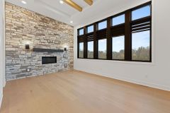 Dining-Room-with-Stone-Fireplace-and-Cedar-Beams-1