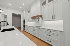 White-Kitchen-with-Black-Accents-and-Luxury-Appliances-2