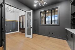 Moody-dark-color-drenched-home-office-with-built-in-cabinetry-3