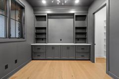 Moody-dark-color-drenched-home-office-with-built-in-cabinetry-6