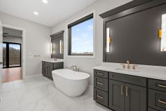 Primary-Bathroom-with-His-and-Her-Black-Cabinetry-with-Gold-Accents-and-Free-Standing-Tub-3