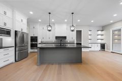 open concept great room and kitchen with custom cabinetry