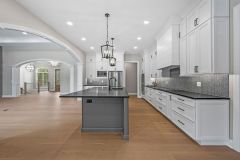 arched entry open concept great room and kitchen