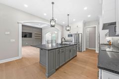  pendant lighting over dark island