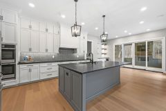 white custom cabinetry brought to the ceiling