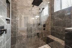 primary shower with rain shower head and window
