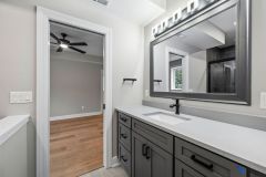 Lower level Bathroom Custom Cabinetry and Framed Mirror