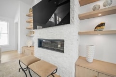 Stack Stone Fireplace with Floating Open Shelving