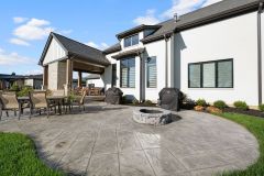Back sun patio with firepit and covered porch