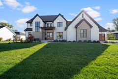 White painted Brick Modern Farmhouse with Cedar Pillar Accents