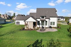 Heartland Haven Back Exterior With Patio and Firepit and Covered Porch