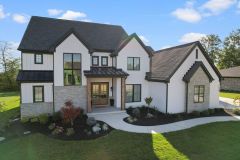 White painted Brick Modern Farmhouse with Stone Accents