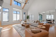 Heartland Haven Great Room with Beams and Window Wall