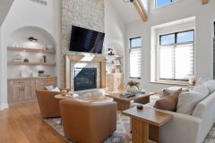 Cathedral Great Room With Beams and Stone Fireplace Arched Built-ins