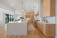 Custom White Oak Cabinetry and Waterfall Edge Island
