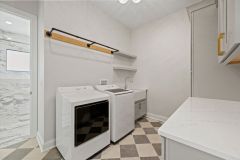 Laundry  with Custom Cabinetry and farmhouse sink