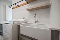 Laundr yWith Custom Cabinetry Farmhouse Sink
