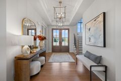 Entry-With-Tray-Ceiling-and-Two-Chandeliers-1
