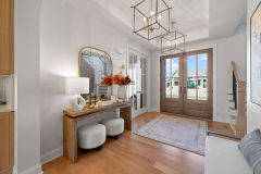 Entry-With-Tray-Ceiling-and-Two-Chandeliers-2