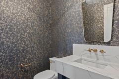 Powder-Room-With-Wall-Mount-Faucet-and-Gold-Accents-2