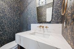 Powder-Room-With-Wall-Mount-Faucet-and-Gold-Accents-3