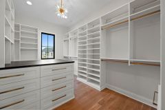 Custom-Walk-In-Closet-With-Island-and-Window-2