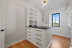 Custom-Walk-In-Closet-With-Island-and-Window-3