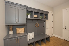 Custom Storage and bench in the mudroom at The Woodford