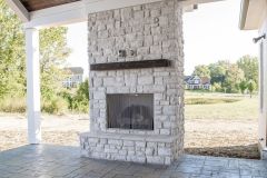 The House of Peace Covered Patio with Fireplace