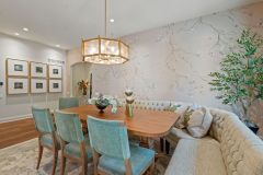 Dining Area Off Kitchen With Chandelier and Blossom Wallpaper