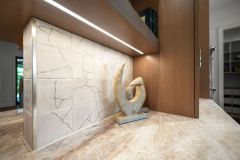 Taj Mahal Quartzite Countertop and Integrated Cabinetry Lighting