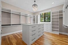 Her Walk-In Closet with Island and Window - The Vandoren