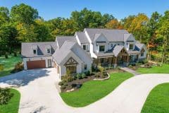Custom home with Gables, Cedar Columns, metal accents and white brick - The Vandoren