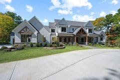 Front view of Liberty Twp custom home  with gables, metal and cedar  accents - The Vandoren