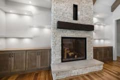 Great Room With Floor To Ceiling Stone Fireplace and Built-ins - The Vandoren