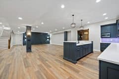 Lower Level with Entertainment Space, Pub Bar and Wine Room and Custom Staircase