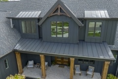 Cincinnati custom home dark exterior cedar pillars