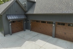 Custom home 3 car garage dark exterior